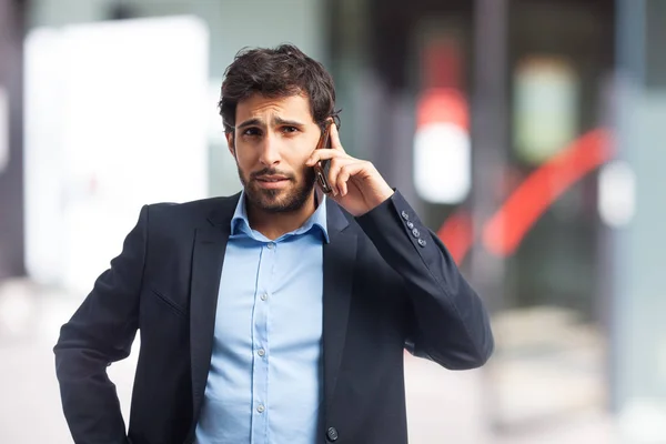 Indian businessman talking on mobile phone — Stock Photo, Image