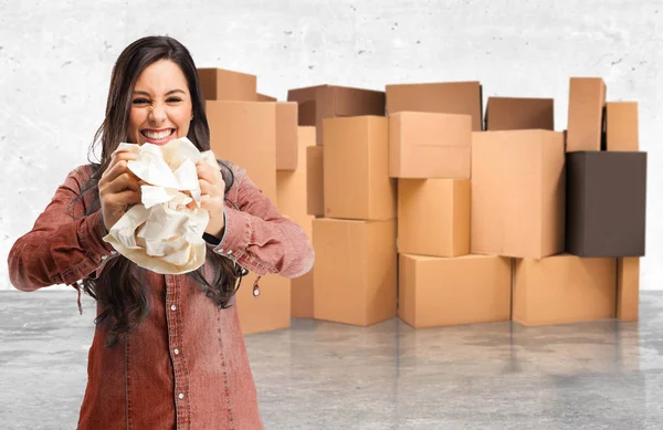 Angry young woman with paper ball — Stock Photo, Image