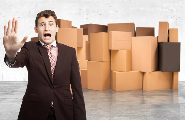 Surprised young man with stop gesture — Stock Photo, Image