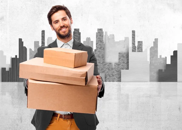 Happy businessman with boxes — Stock Photo, Image