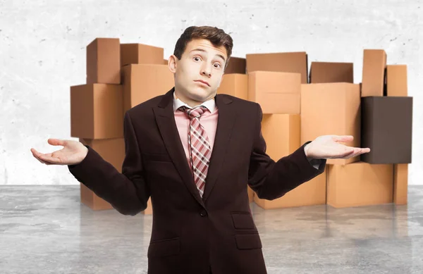 Happy businessman in confused pose — Stock Photo, Image