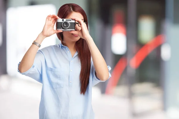 Happy chinese woman with camera — Stock Photo, Image