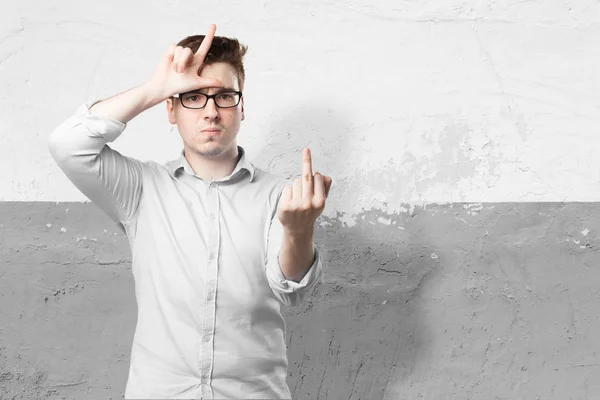 Angry young man with loser sign — Stock Photo, Image