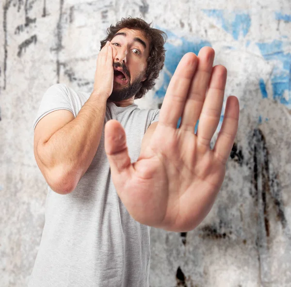 Scared young man with frightened sign — Stock Photo, Image