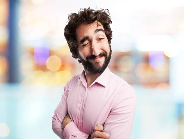 Happy young man with wink sign — Stock Photo, Image