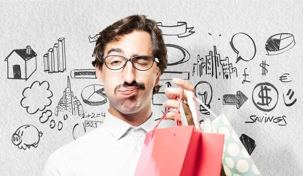 Joven fresco hombre con bolsas de compras — Foto de Stock