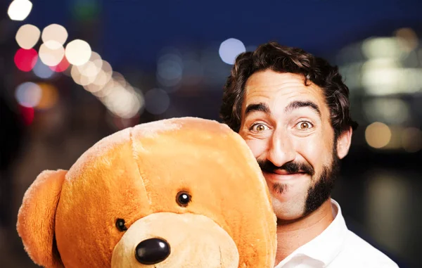 Young cool man with a teddy bear — Stock Photo, Image