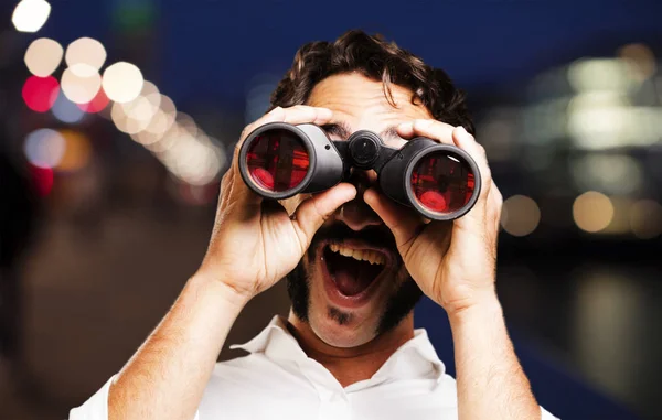 Young cool man with binoculars — Stock Photo, Image