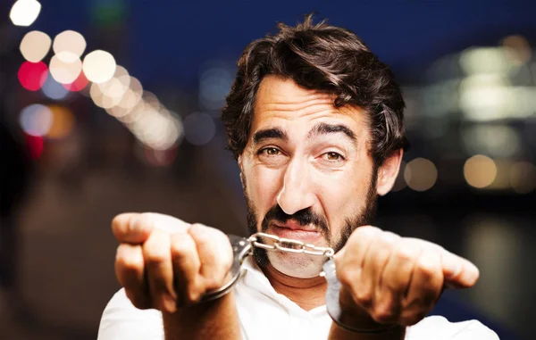 Young cool man with handcuffs — Stock Photo, Image