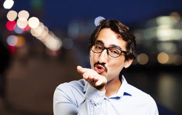 Leuke jongeman met lucht kus — Stockfoto