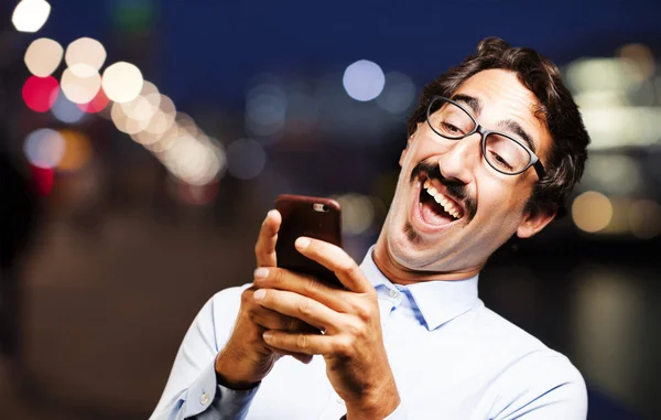 Young cool man with a mobile phone — Stock Photo, Image