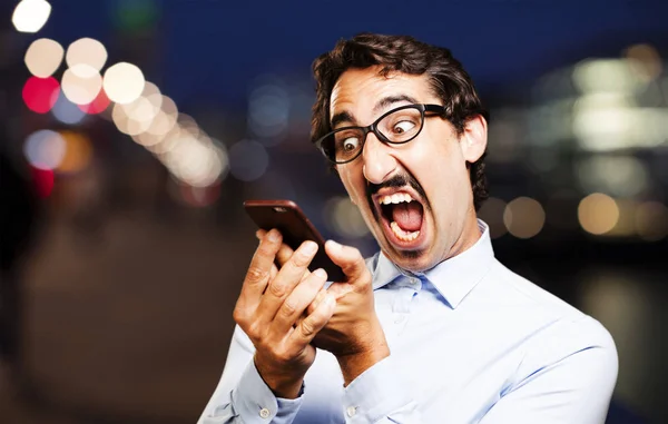 Young cool man with a mobile phone — Stock Photo, Image