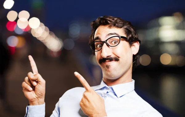 Young cool man showing something — Stock Photo, Image