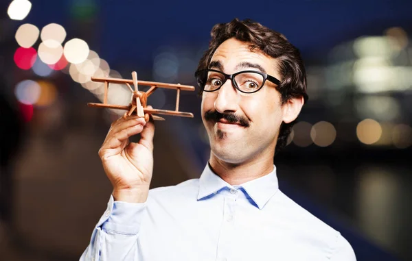 Joven fresco hombre con un avión de madera —  Fotos de Stock