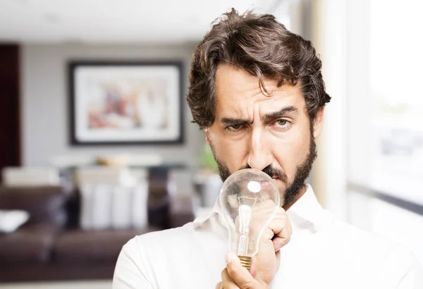 Joven fresco hombre con una bombilla — Foto de Stock