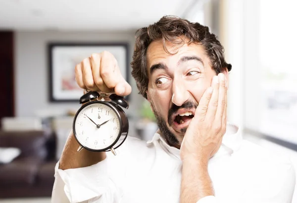 Young cool man with a alarm clock — Stock Photo, Image