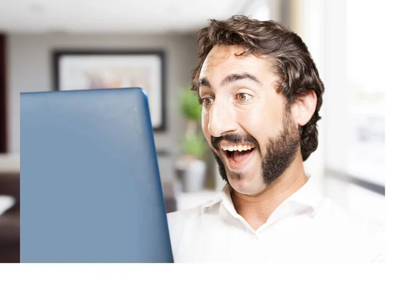 Young cool man with a laptop — Stock Photo, Image