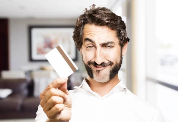 Jovem legal homem com cartão de crédito — Fotografia de Stock