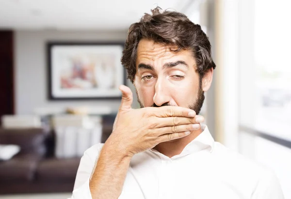 Young cool man covering mouth — Stock Photo, Image