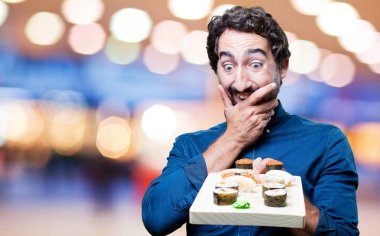 Genç adam yemek suşi