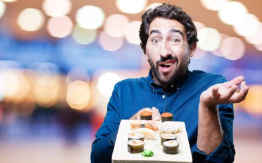 Genç adam yemek suşi