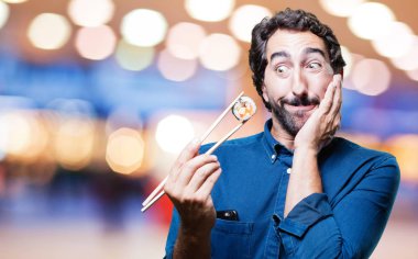 Genç adam yemek suşi