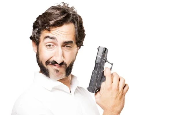 Young cool man with gun — Stock Photo, Image
