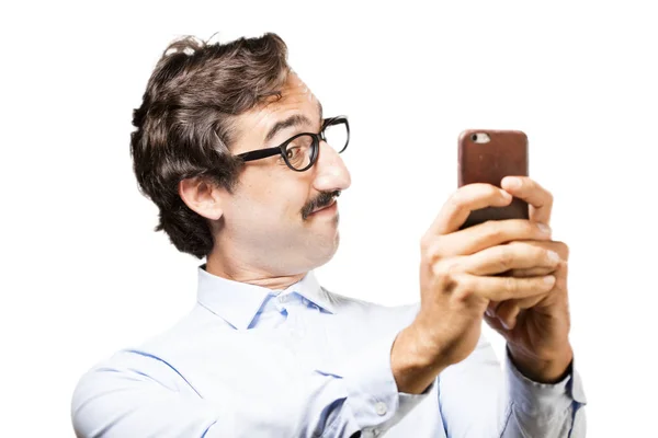 Joven hombre fresco con un teléfono móvil —  Fotos de Stock