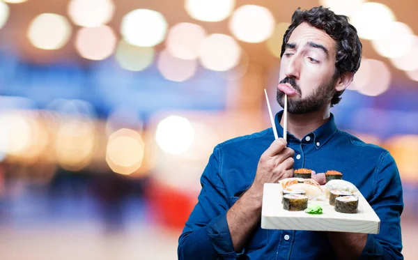 若い男を食べる寿司 — ストック写真