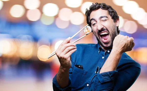 Man eating sushi with all right sign — Stock Photo, Image