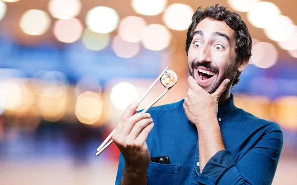 young man eating sushi