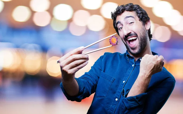 man eating sushi with all right sign