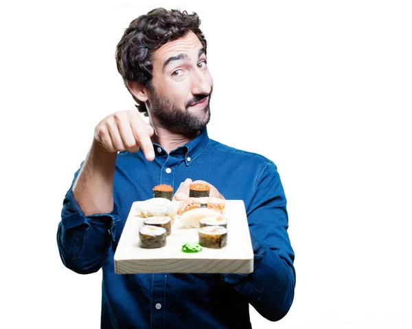 Mann isst Sushi und zeigt Zeichen — Stockfoto