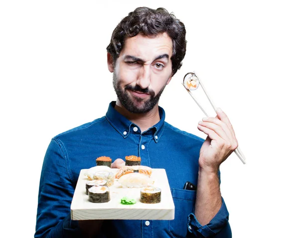 Man eating sushi in proud pose — Stock Photo, Image