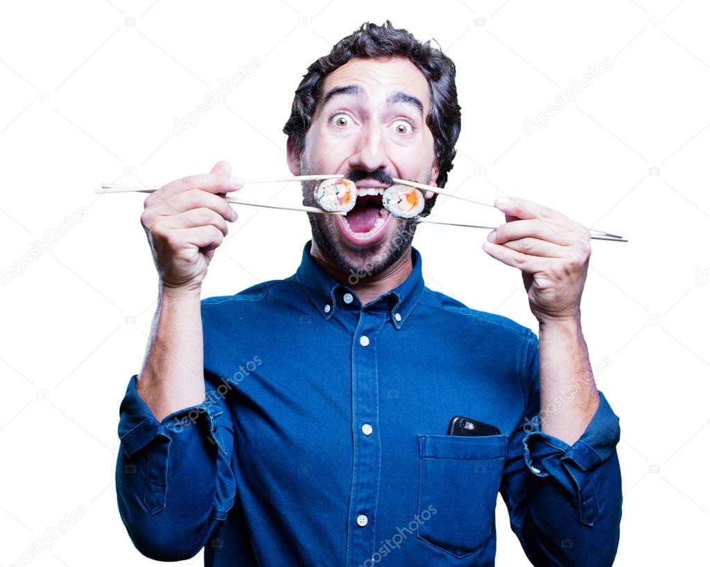 young man eating sushi