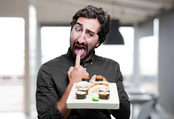 Человек ест суши с рвотой знак — стоковое фото