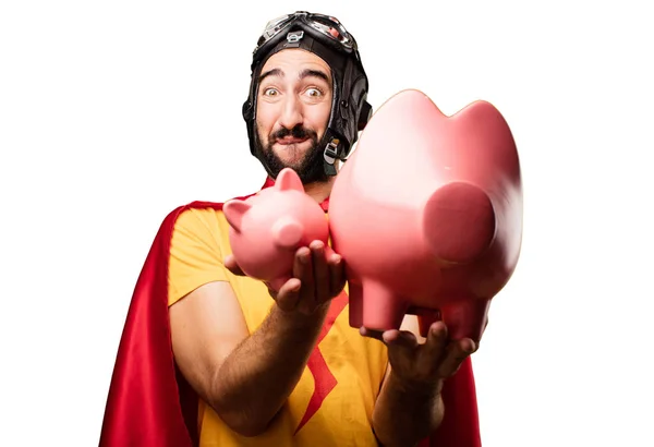 Crazy super hero with piggy banks — Stock Photo, Image