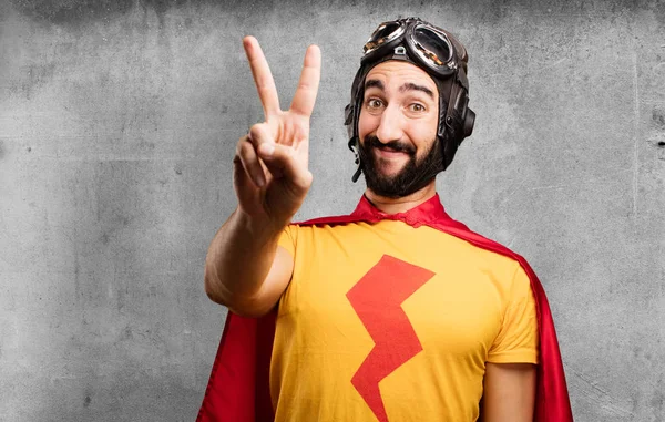 Crazy super hero with victory sign — Stock Photo, Image