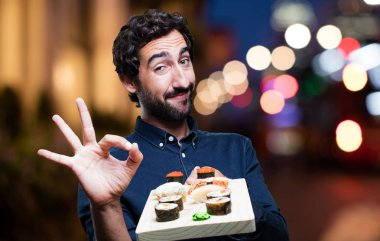 man yemek suşi Tamam işareti ile