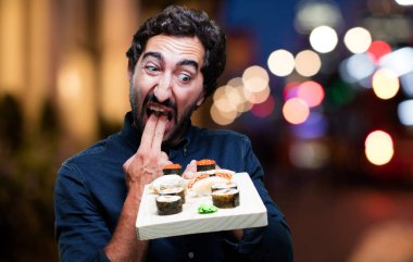 man yemek suşi kusmuk işareti ile