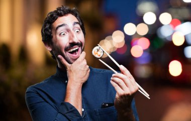 Genç adam yemek suşi