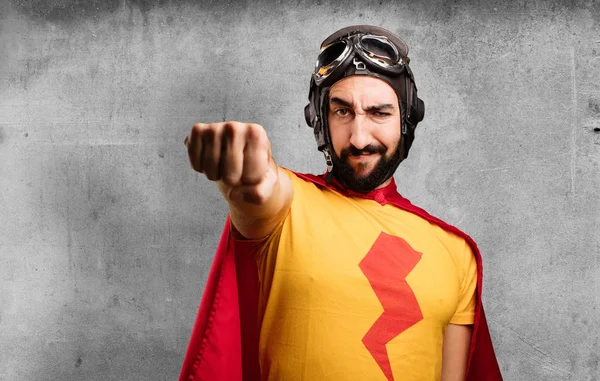 Сумасшедший супергерой со знаком кулака — стоковое фото