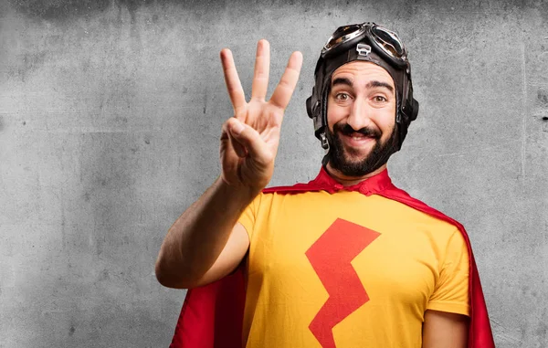 Crazy super hero with numbers sign — Stock Photo, Image