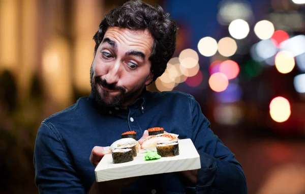 Genç adam yemek suşi