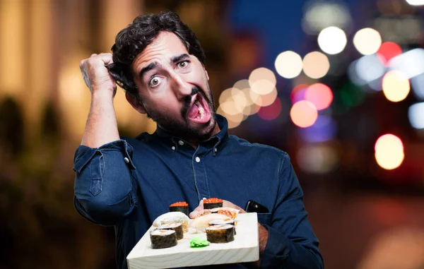 man yemek suşi şok poz