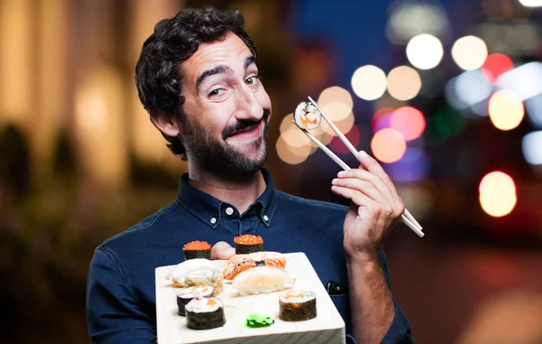 Genç adam yemek suşi