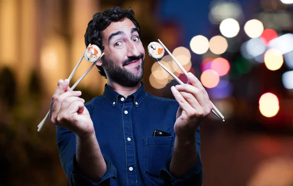 Genç adam yemek suşi