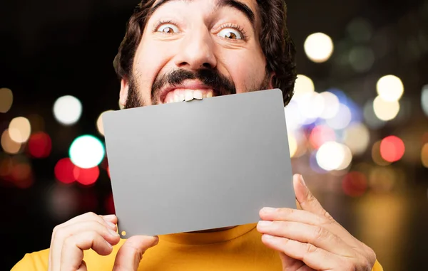Young crazy man with placard — Stock Photo, Image
