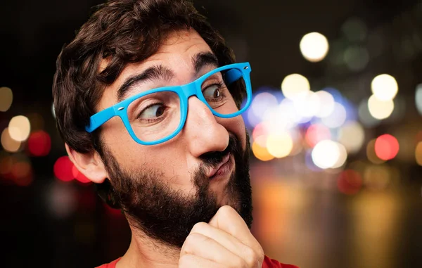 Young crazy man with doubting face — Stock Photo, Image