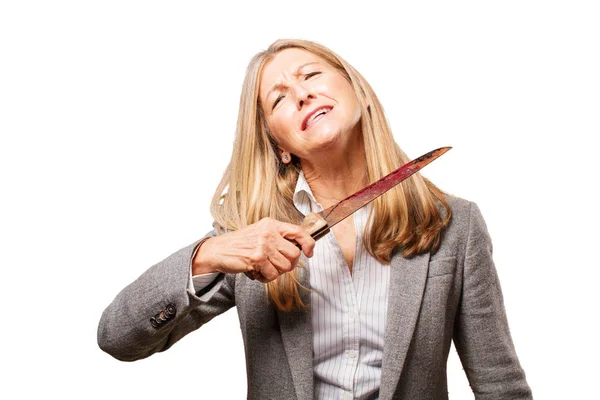 Senior beautiful woman with knife — Stock Photo, Image